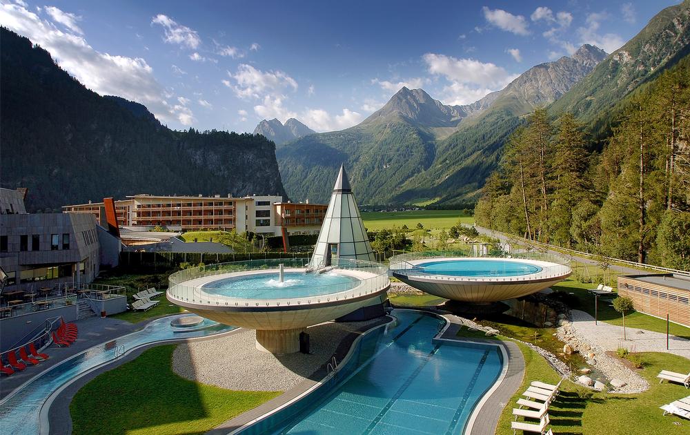 The Aqua Dome in Tirol, Austria, features outdoor thermal pools in a dramatic Alpine setting