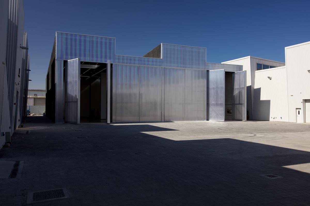 A translucent façade with full-height doors 'seamlessly connects' Concrete’s interior with the complex’s large central courtyard / Mohamed Somji, courtesy Alserkal Avenue