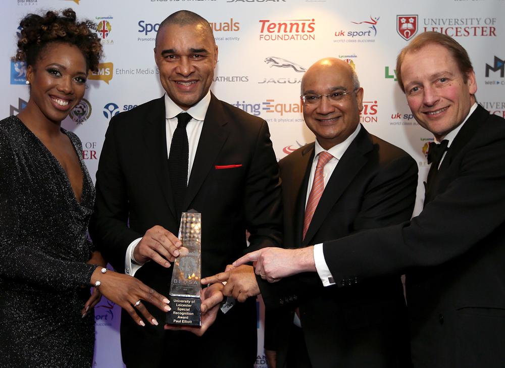 Keith Vaz MP (centre right) hands an award to Paul Elliott