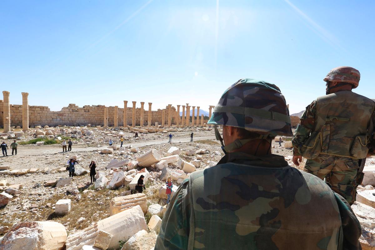 Soldiers look over damage at the historical Bel Temple in the ancient city of Palmyra / Uncredited/AP/Press Association Images Soldiers look over damage at the historical Bel Temple in the ancient city of Palmyra / Uncredited/AP/Press Association Images