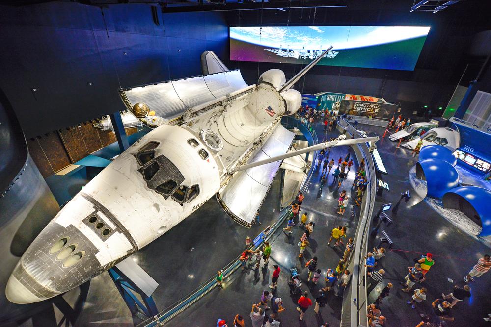 The shuttle is displayed on an angle, as though in flight, so visitors can see the base and sides / PHOTO: © kennedy space center visitor complex