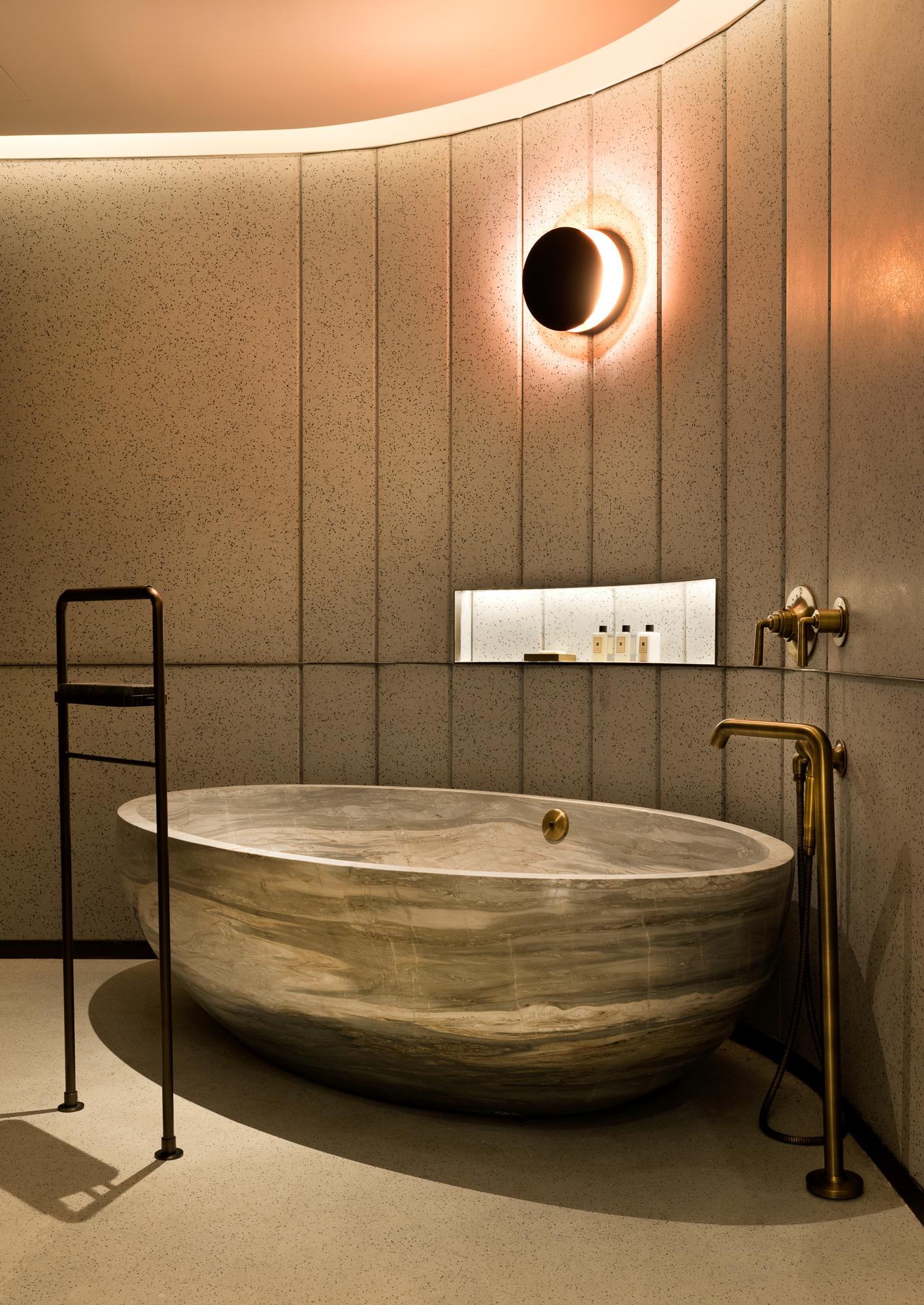The suite's master bathroom has been built around a freestanding one piece marble Palissadro bathtub The suite's master bathroom has been built around a freestanding one piece marble Palissadro bathtub
