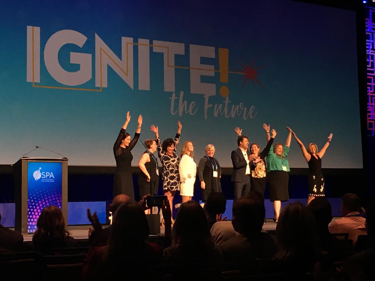 Members of the ISPA board and ISPA Foundation chair Frank PItsikalis celebrate the theme of this year's event, 'Ignite the Future.' / 