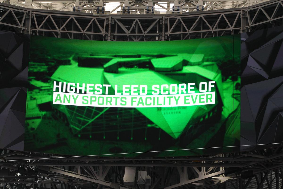 The stadium proudly displays its new achievement on the LED big screen / HOK