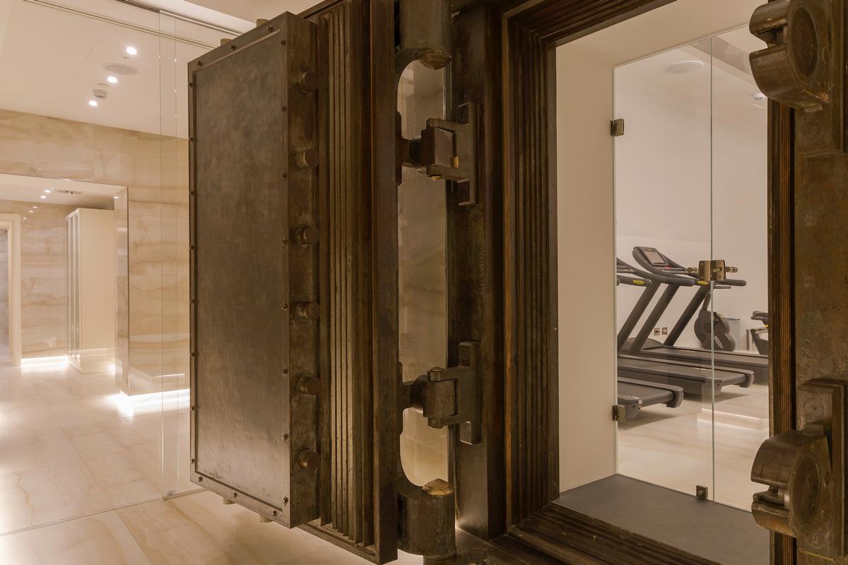 A state-of-the-art gym with Technogym machines is housed in the original bank vault