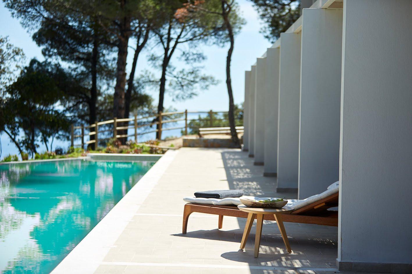 The resort will boast an outdoor pool located on the hilltop overlooking Ambelakia Beach and the Aegean Sea / 