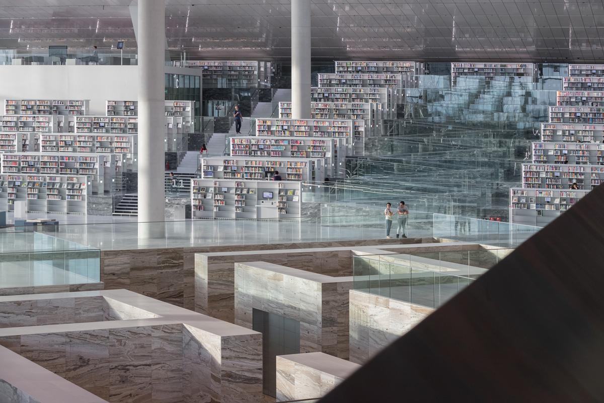 Conceived as a space for reading, socialising and browsing, the building houses more than a million books and space for thousands of readers over an area of 42,000sq m (452,000sq ft) / Delfino Sisto Legnani and Marco Cappelletti, courtesy of OMA