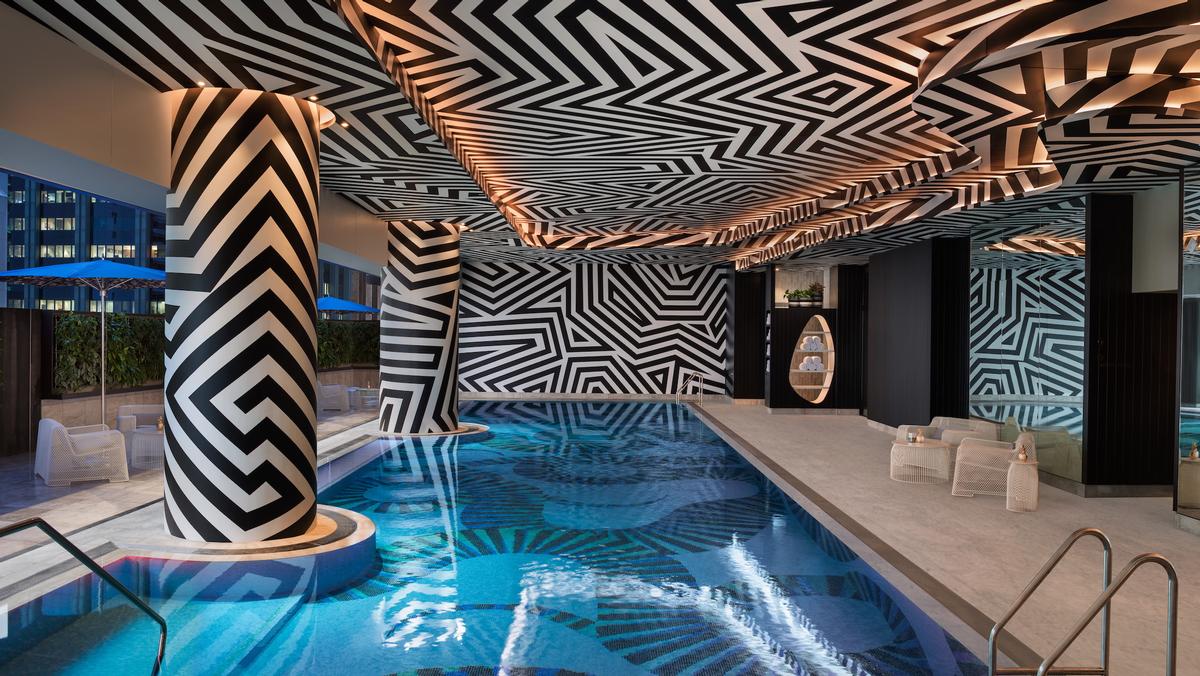 The WET Deck's pool is designed with a mosaic of tiles reminiscent of the shadows cast by palm fronds