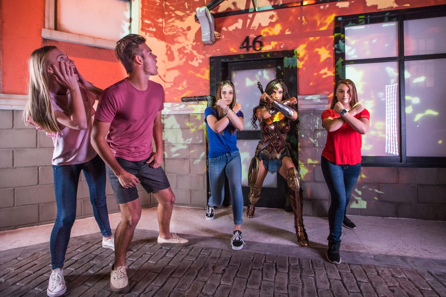 Visitors throw 'power gauntlets' with Wonder Woman's by striking her signature power pose Visitors throw 'power gauntlets' with Wonder Woman's by striking her signature power pose
