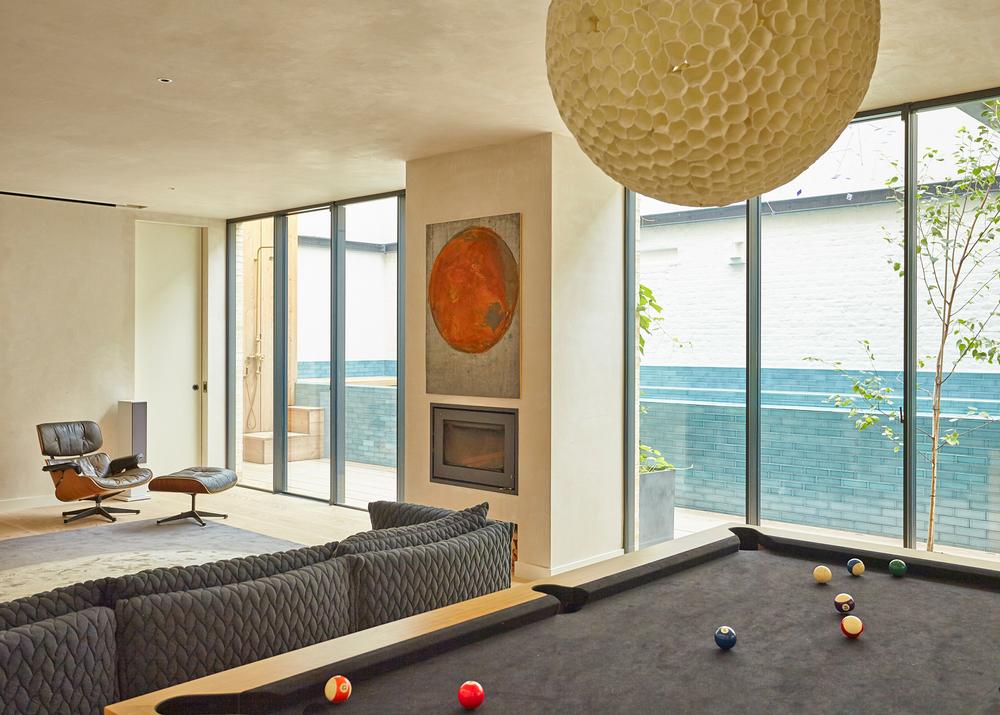 The house features a pool table and a cinema room, to keep both the adults and children connected.