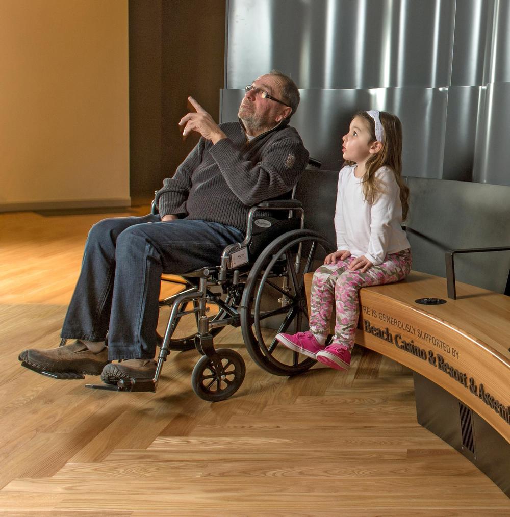 Benches featuring hand rails and Universal Keypads provide physical and auditory support