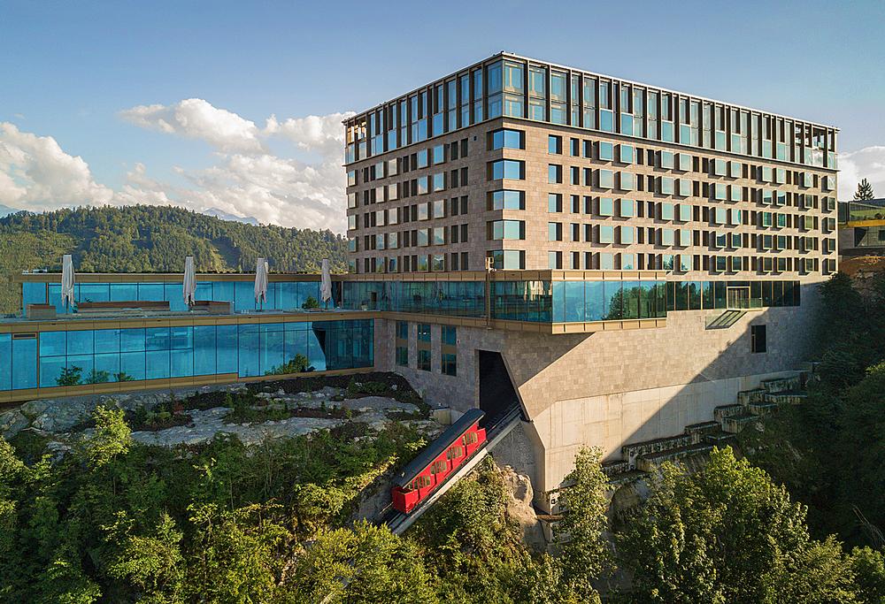 Guests arrive at the new resort on a historic red funicular railway