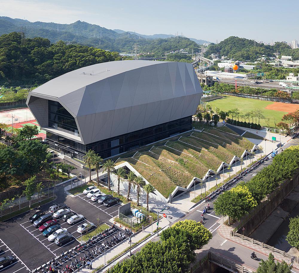 Taipei’s Zhonghe Sports Centre has a curved and faceted exterior form that resembles a giant armadillo