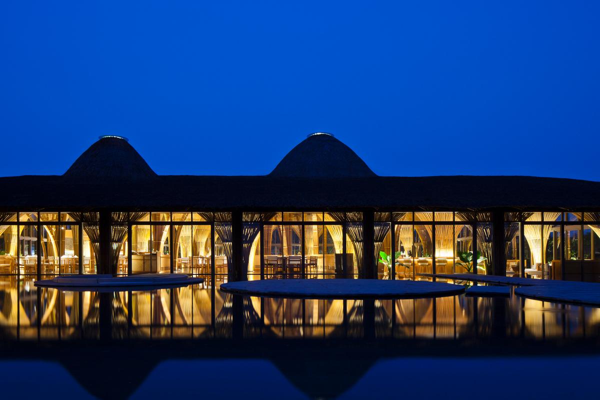 Naman Resort is a tropical complex containing 80 guest bungalows, 26 villas, a hotel and five-star spa facilities / Vo Trong Nghia Architects
