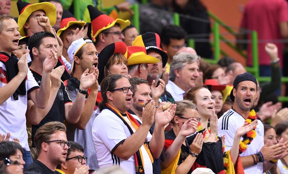 German supporters cheer for their handball team in one of the permanent stadiums built for the Rio 2016 Olympics / lukas schulze / press association
