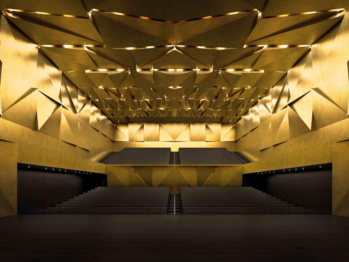 The auditorium interiors are golden with faceted panels / Simon Menges The auditorium interiors are golden with faceted panels / Simon Menges