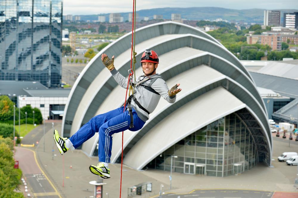 Tom Daley taking part in a Glasgow 2014 event at the Scottish Exhibition and Conference Centre, which will host judo and netball next year