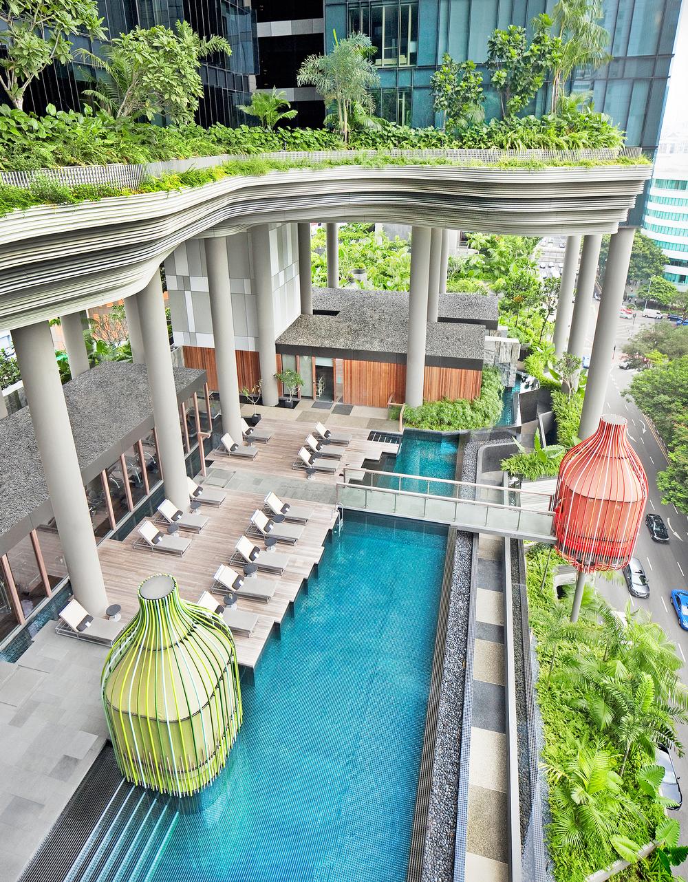 The pool at Parkroyal on Pickering is set amongst lush plantlife, which can be explored via a network of pathways