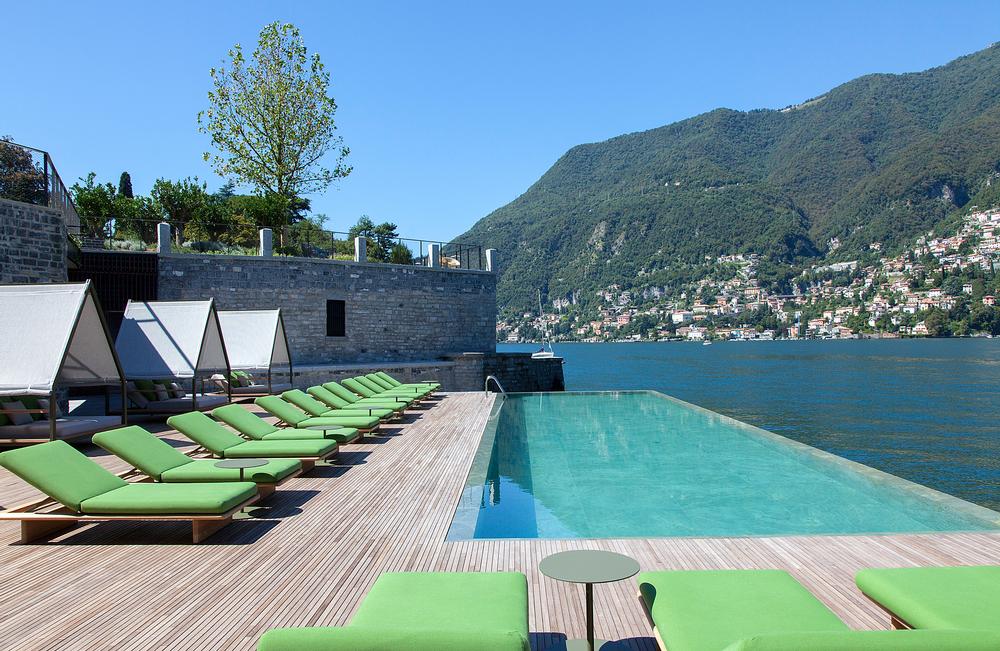 An infinity pool looks out across the lake, Italian Alps and small towns and the hotel also has a private beach.