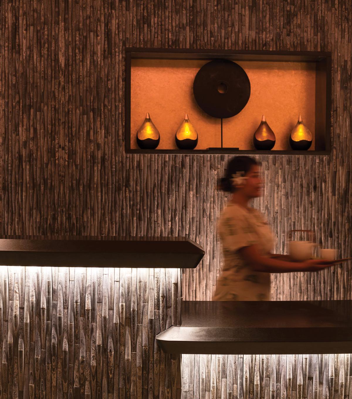 The 11-treatment room spa features a clean, contemporary design, incorporating natural wood found throughout the islands and a slate reception desk / Four Seasons The 11-treatment room spa features a clean, contemporary design, incorporating natural wood found throughout the islands and a slate reception desk / Four Seasons