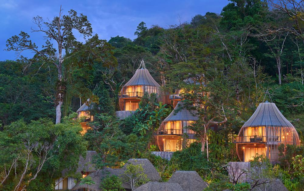 The Keemala resort features seven two-storey Tree Pool Houses, which are made from glass, encased by a bamboo and metal shell