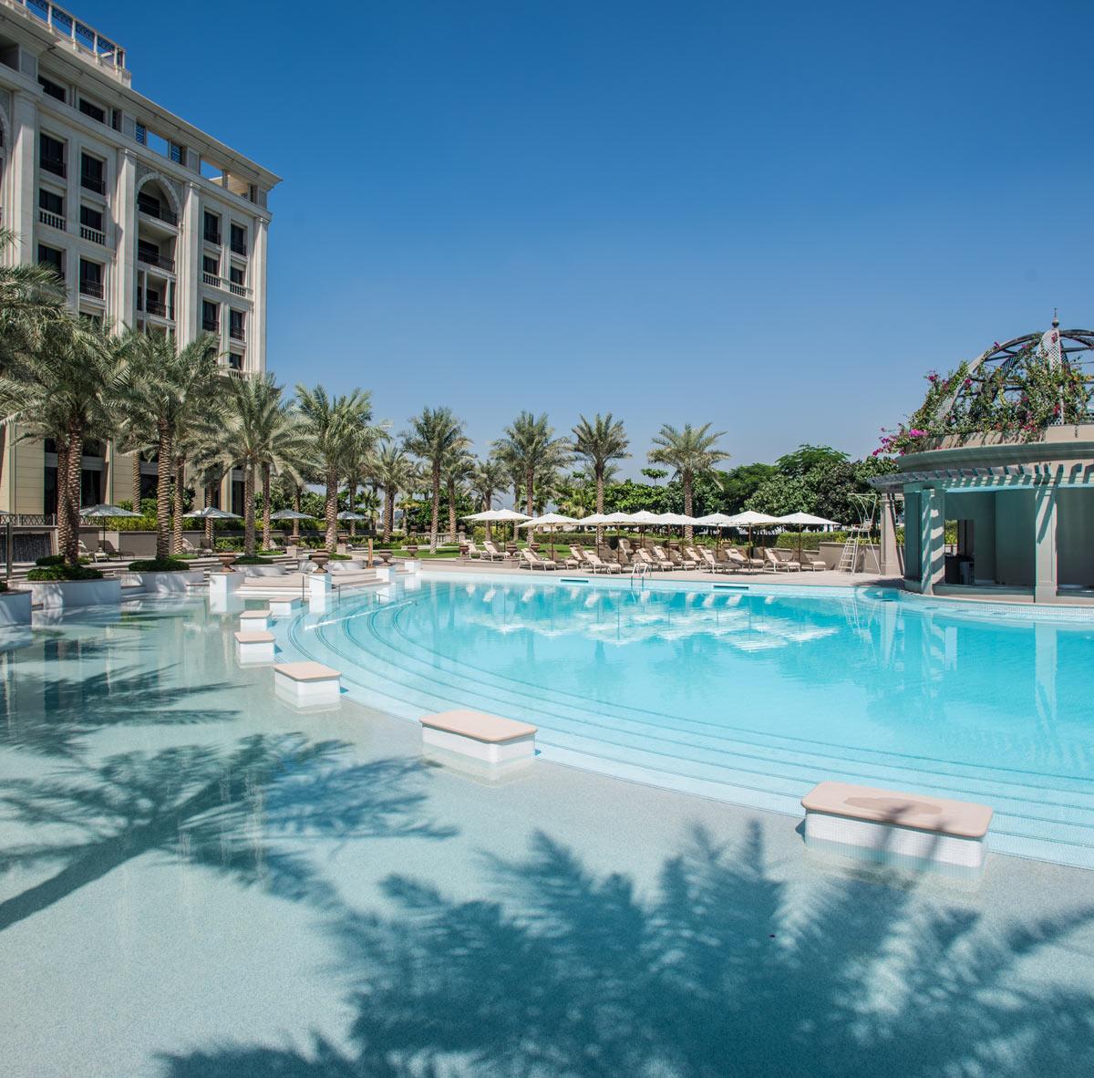 In addition to the guestrooms, the hotel includes an internal courtyard for dining, three outdoor swimming pools, landscaped gardens and a spa / Palazzo Versace Dubai