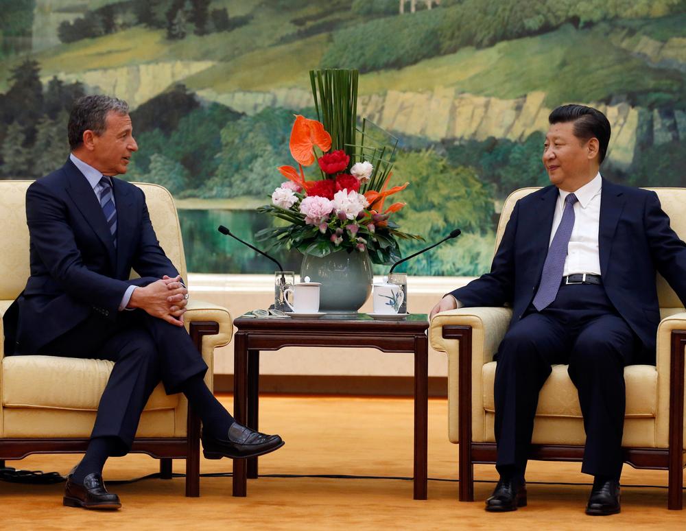 Chinese President Xi Jinping, right, meets Walt Disney CEO Bob Iger on 5 May / Kim Kyung-hoon / Alex J. Berliner/AP/PA Images