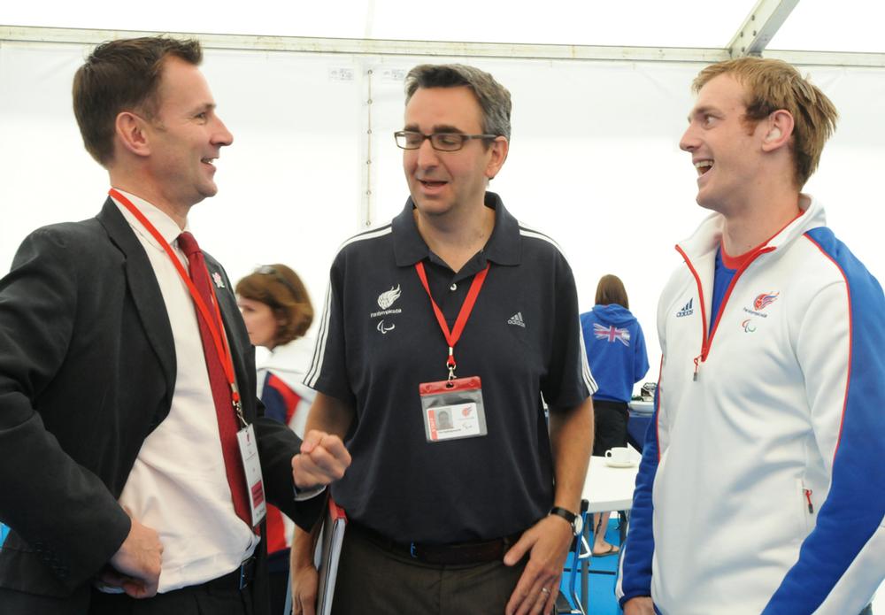From Left: Secretary of State Jeremy Hunt talks to Tim and a Paralympian