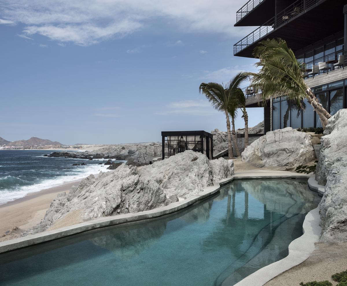 The property offers an freshwater infinity pool with a swim-up bar and a saltwater pool built into a natural rock formation / Thomas Hart Shelby