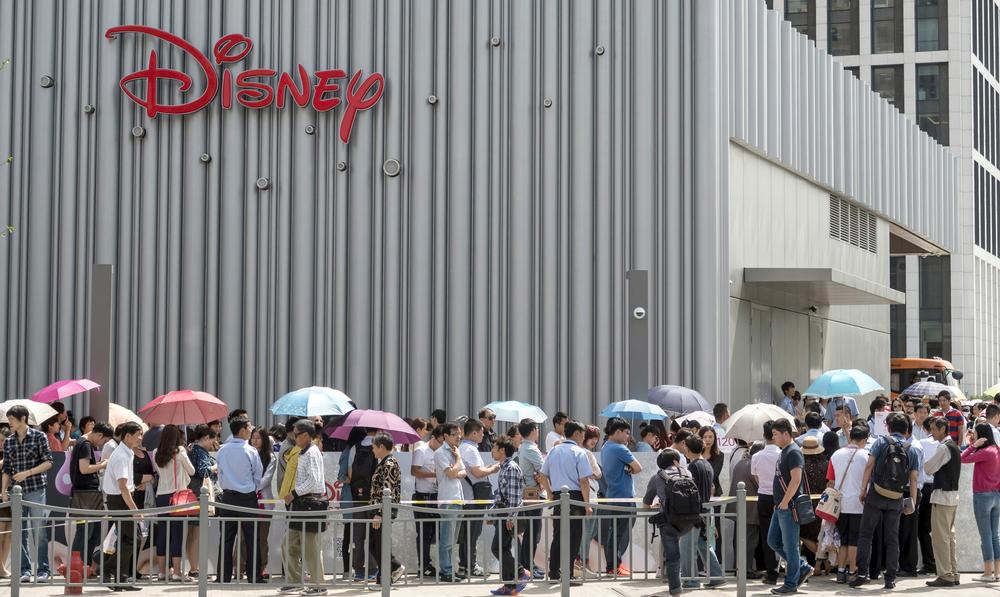 Shoppers queue outside a Disney store in Shanghai, China. It’s one of the largest Disney stores in the world and has been raising brand awareness