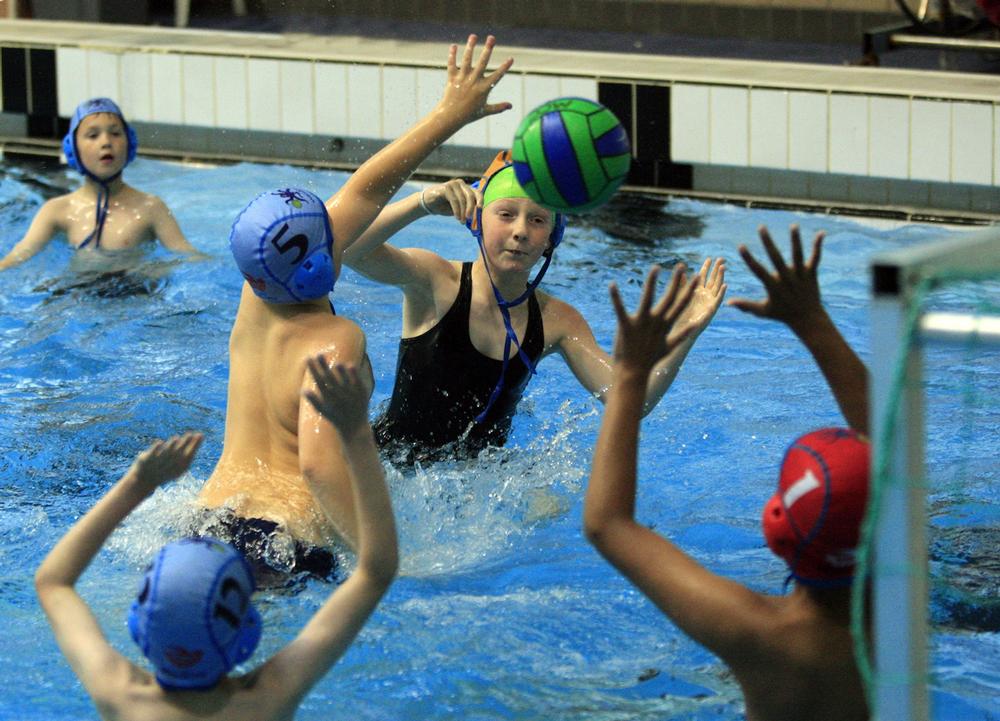 Children develop specific aquatic skills in Mini Water Polo programmes held at swimming centres across the country