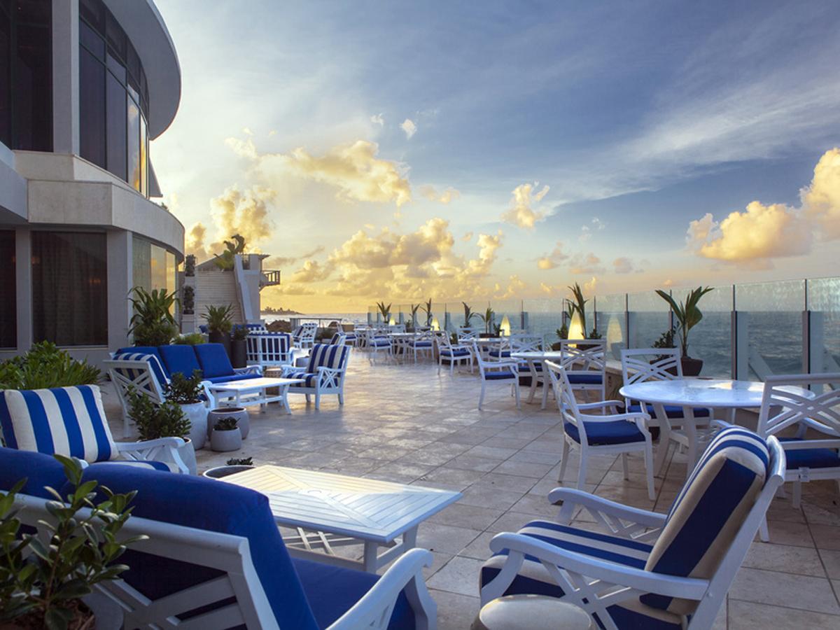 The hotel’s oceanfront terrace provides a pathway to the two new pool lounge areas which are located on either side of the suite towers / The Condado Vanderbilt Hotel