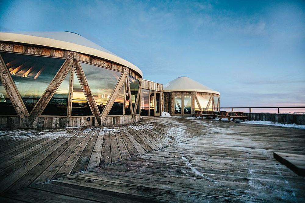 The circular, wooden Summit Skylodge on the top of Powder Mountain. Construction was completed on the building in 2013
