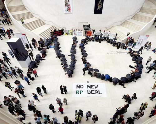 Anti-oil protesters congregate in the British Museum’s great court to form the word 'no' in giant letters
