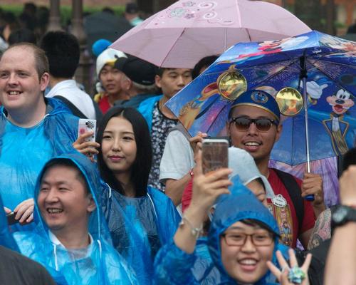 The park didn't quite have a fairytale opening, with grey skies complicating proceedings / Ng Han Guan/AP/Press Association Images