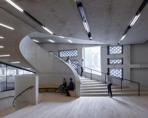 The perforated brickwork allows light into the building / Iwan Baan
