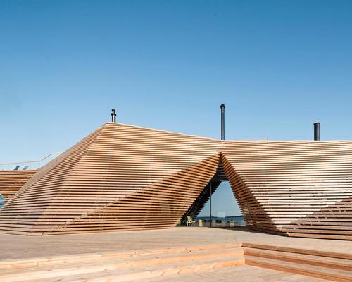 Wooden slats clad the multi-faceted, pyramid-like structure / kuvio.com