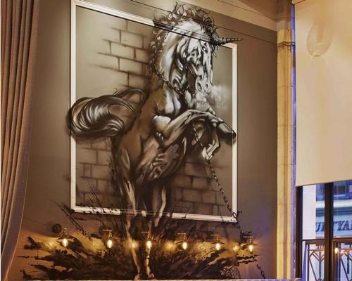 Local artist Gaz Mackay has created a large mural of a unicorn for the bar / James Harris