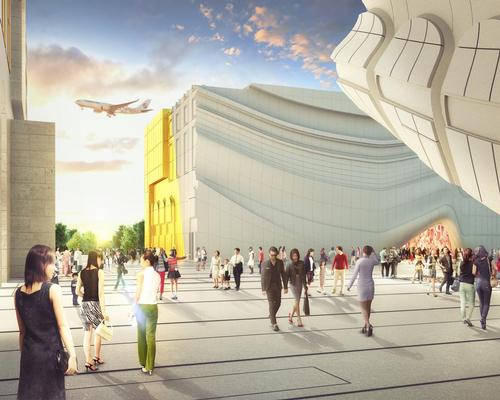 The flowing façades designed to emulate draping curtains that entice visitors inside / MVRDV