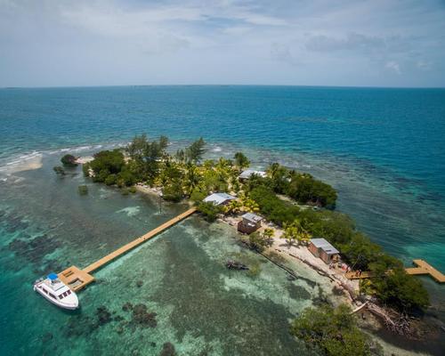 The remote two-acre Coral Caye island is sheltered behind the Belize Barrier Reef / The Family Coppola