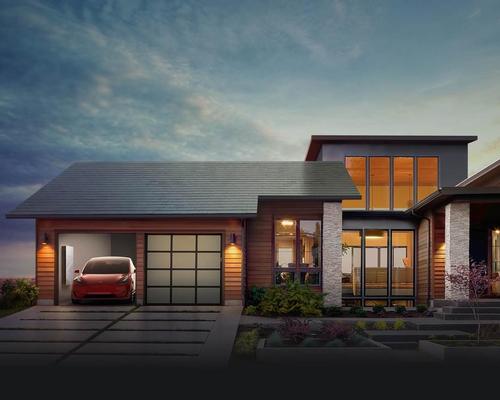 Each solar roof tile uses coloured film to disguise the presence of fully integrated solar cells / Tesla