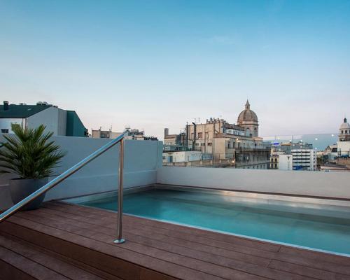 A rooftop offers a pool with a panoramic view over the city / Midmost Hotel