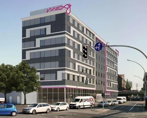 Prefabricated timber modular hotel rooms with an attached wet-box element were produced at a factory and quickly assembled on-site / Moxy Berlin