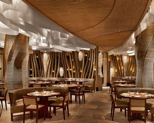 The design palette crafted by Rockwell' draws upon raw, natural forms and layers of materials such as walnut, bronze, washi paper, linen and leather' / Nobu Miami Beach