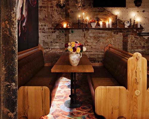 The basement-level Rose Garden is an intimate cocktail bar with chandeliers, eclectic antique wall décor and giant rose motifs hand-painted by local artisans
