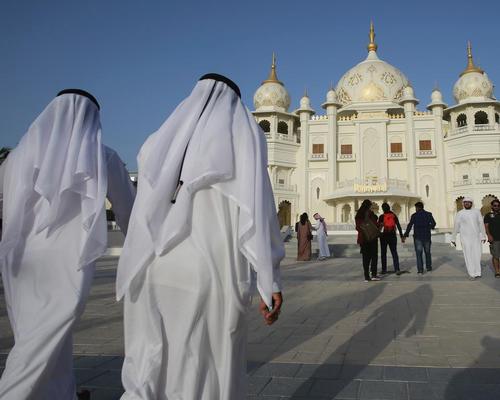 People visit the Rajmahal building at Dubai Parks & Resorts in Dubai, United Arab Emirates / AP Photo/Kamran Jebreili