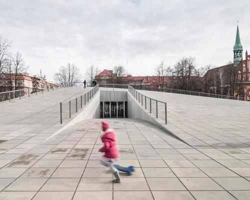 The National Museum and Dialogue Centre Przelomy is largely located underground, with its roof forming a new public space / KWK Promes