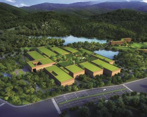 The landscape flows through the buildings towards a lake at the foot of the site / Zhejiang Natural History Museum