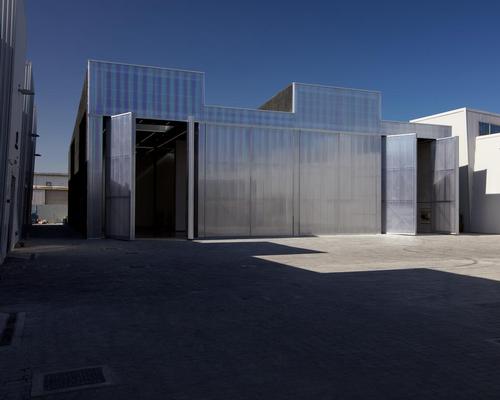 A translucent façade with full-height doors 'seamlessly connects' Concrete’s interior with the complex’s large central courtyard / Mohamed Somji, courtesy Alserkal Avenue