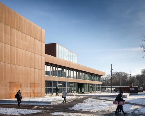 A rust-red steel facade runs around the building / Adam Mørk